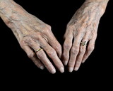 Aging process - very old senior woman hands isolated on black background. Hands, wrinkled skin. Life passes.