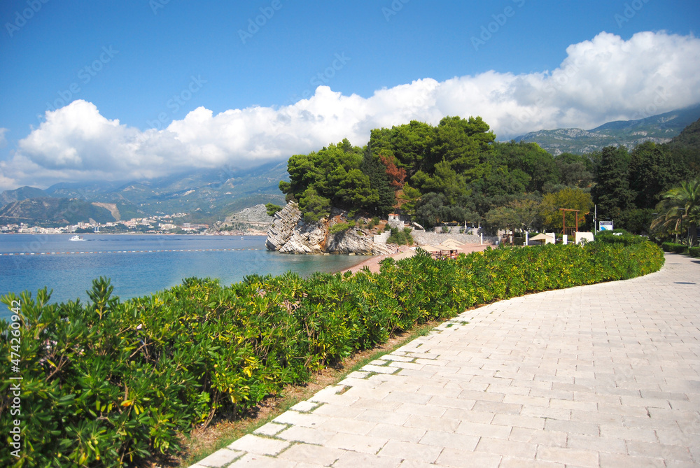 Sea landscape and beautiful cityscape. The coastal strip of Montenegro. Rocky coast. Old Town of Budva, medieval walled city, bay, mountains, coastal strip, sandy beaches on Adriatic Sea, Montenegro. Sea landscape and beautiful cityscape. The coastal strip of Montenegro. Rocky coast. Old Town of Budva, medieval walled city, bay, mountains, coastal strip, sandy beaches on Adriatic Sea, Montenegro.