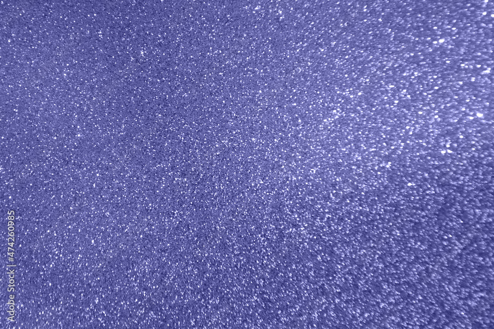 Abstract violet background Very peri tones. Glitter texture christmas background. Defocused abstract holidays lights on background. Abstract violet background Very peri tones. Glitter texture christmas background. Defocused abstract holidays lights on background.