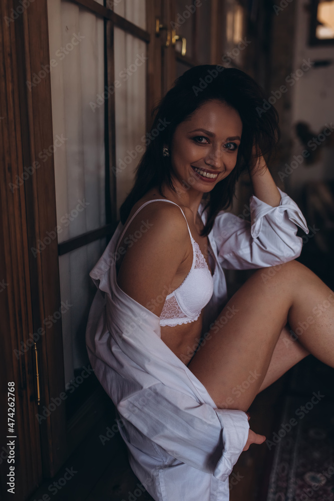 Fototapeta premium Brunette young beauty caucasian woman in white fashion lingerie