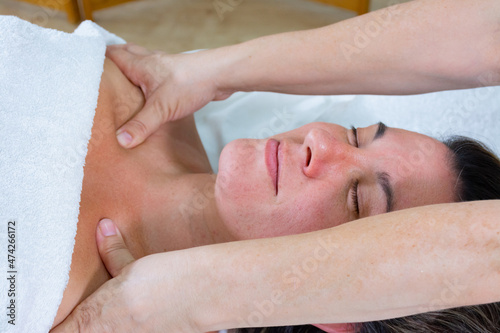 Energetic massage on the clavicles of woman