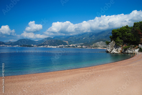 Fototapeta Naklejka Na Ścianę i Meble -  Canvas chairs on the beach. The coastal strip of Montenegro. Sandy beach of Montenegro.