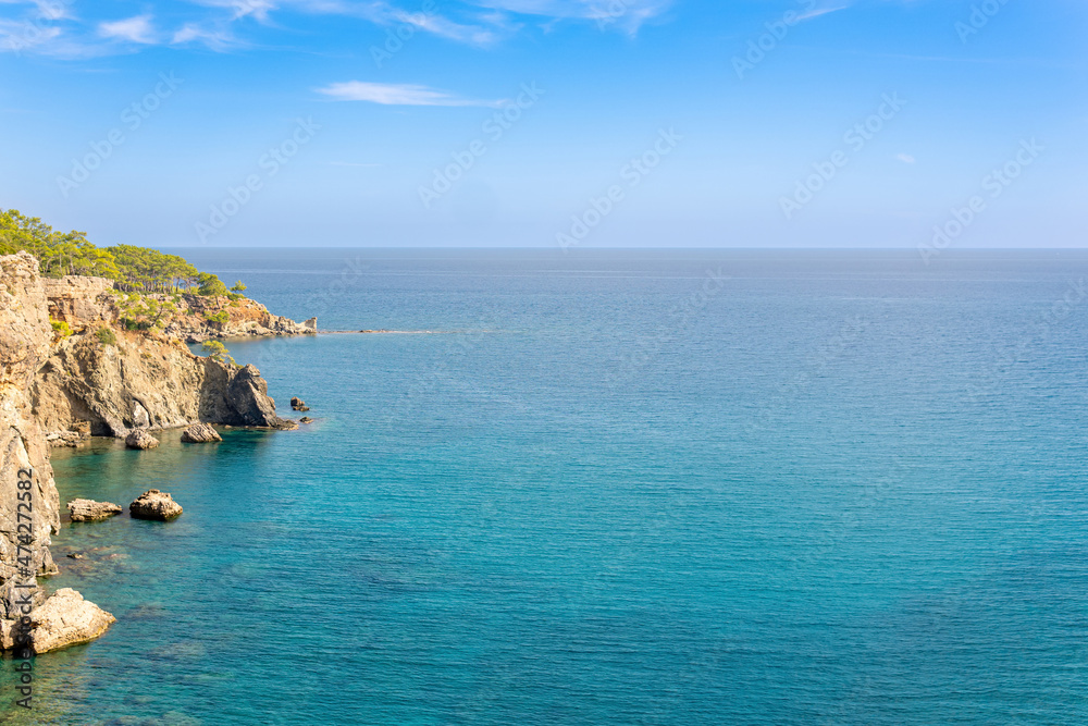 Mediterranean seascape with steep wooded coast