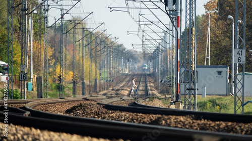 Minsk Mazowiecki, Poland - October 14, 2019: Railway crossing and cars and people crossing it photo