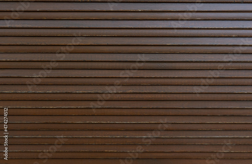 old brown external blinds on windows- texture. wooden surface. creative background
