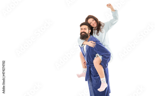 Hurrah. Happy girl ride piggy-back on guy. Happy family enjoy fun. Playful couple. Family in morning photo