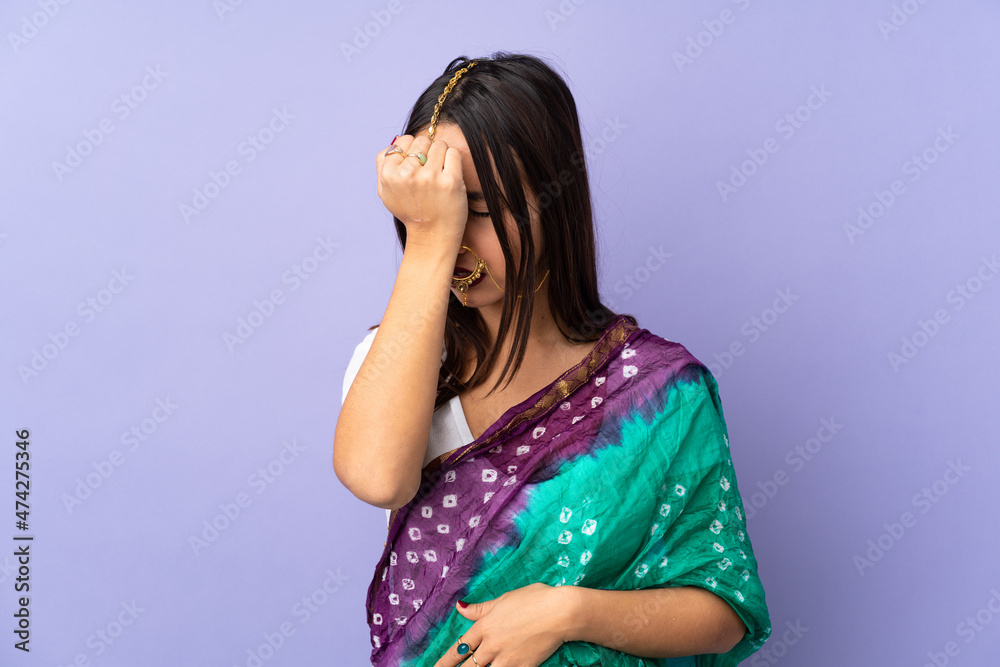 Young Indian woman isolated on purple background with headache Young Indian woman isolated on purple background with headache