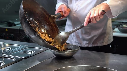 Chef serving udon noodles at restaurant