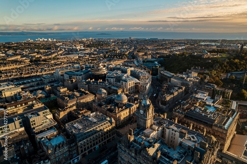 Aerial view of Edinburgh as sun rises over the city. Old city wakes up with the sunrise. Early morning haze lifts as the first rays of sunlight hit the city of Edinburgh  Scotland