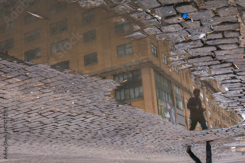 man reflection street in the town