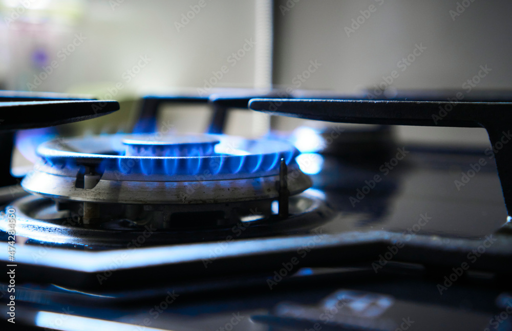 Kitchen stove grate on a burner fuelled by combustible natural gas or