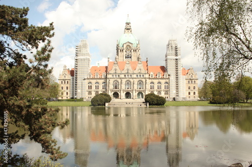 Hannover  Germany  Town hall  Neues Rathaus  seen from its backside across the lake  with reflection and blue-white sky  May 2021