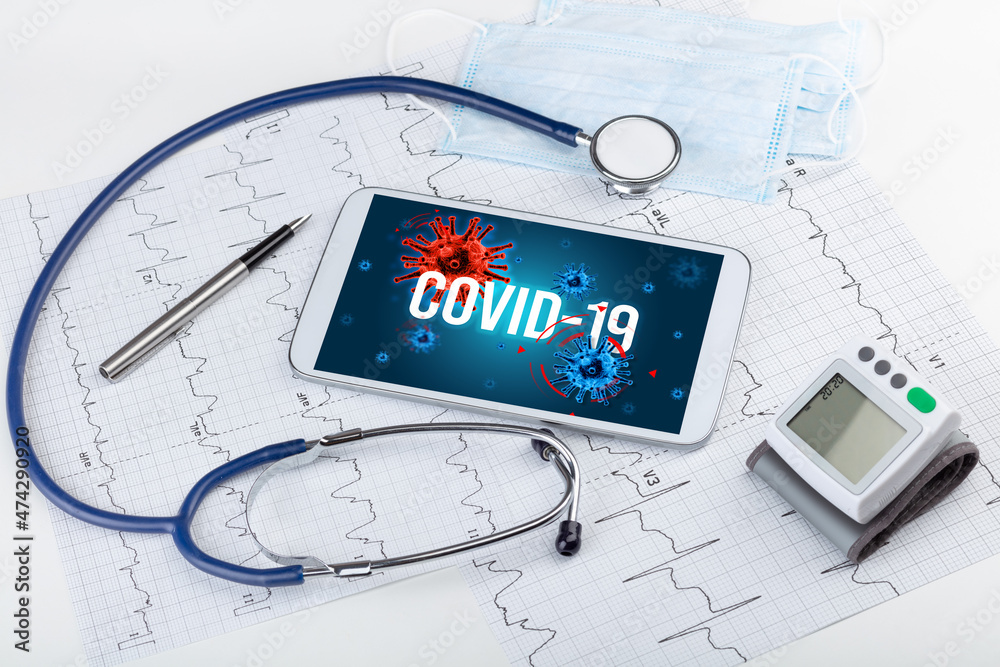 Tablet pc and doctor tools on white surface Tablet pc and doctor tools on white surface