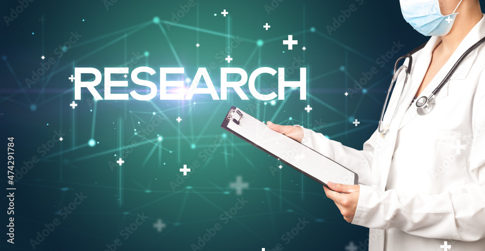 Doctor fills out medical record Doctor fills out medical record