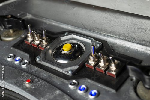 Futuristic spaceship abstract technological control panel with toggle switches and buttons or panel of unknown device or space ship