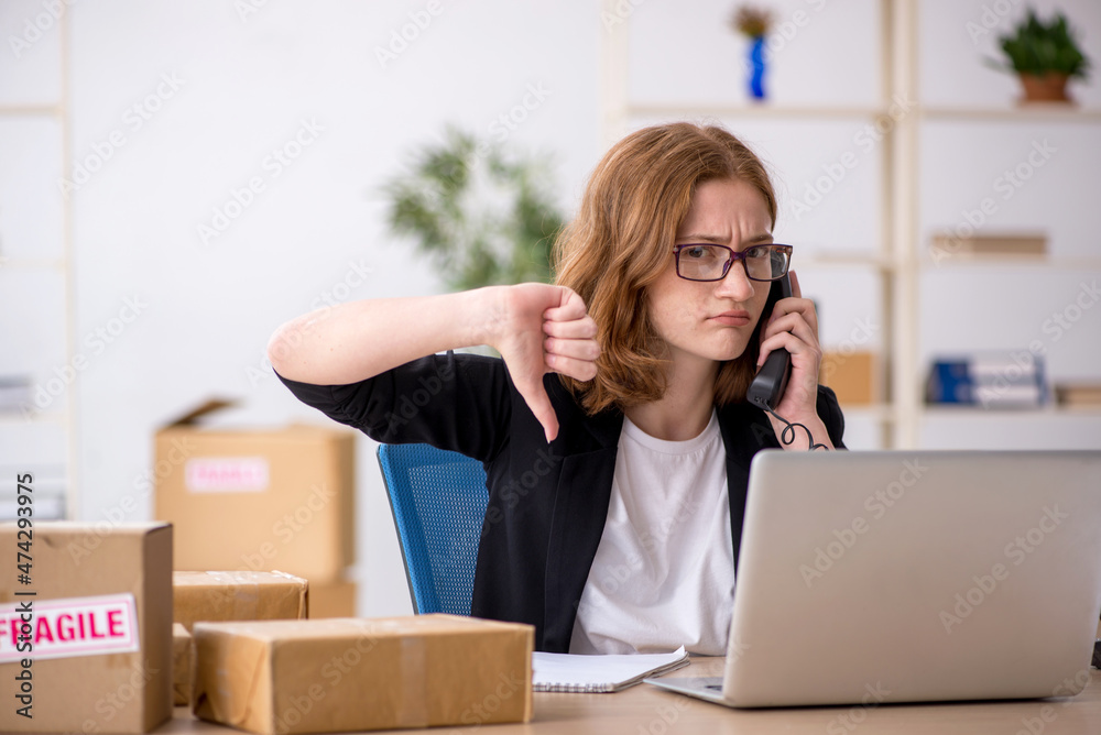 Young woman working in box delivery service Young woman working in box delivery service