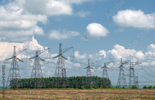 high-voltage power lines at sunset,high voltage electric transmission tower