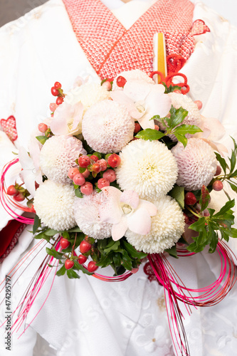 Bride with peony bouquet and colored uchikake photo