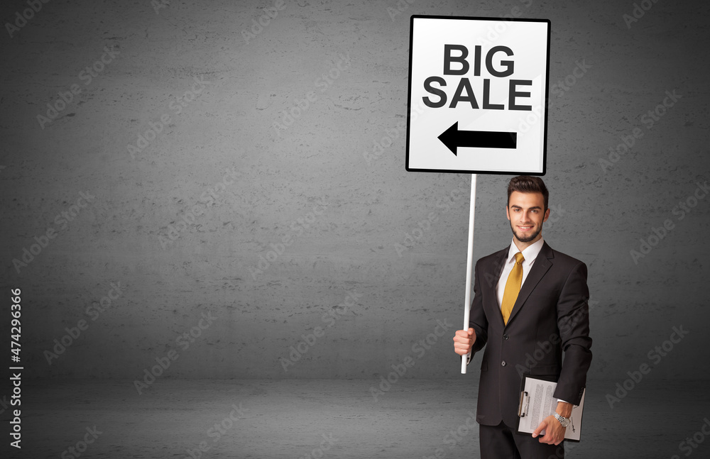 business person holding a traffic sign business person holding a traffic sign