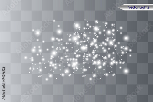 The dust sparks shine with special light. Vector sparkles on a transparent background. Christmas light effect. Sparkling magical dust particles.