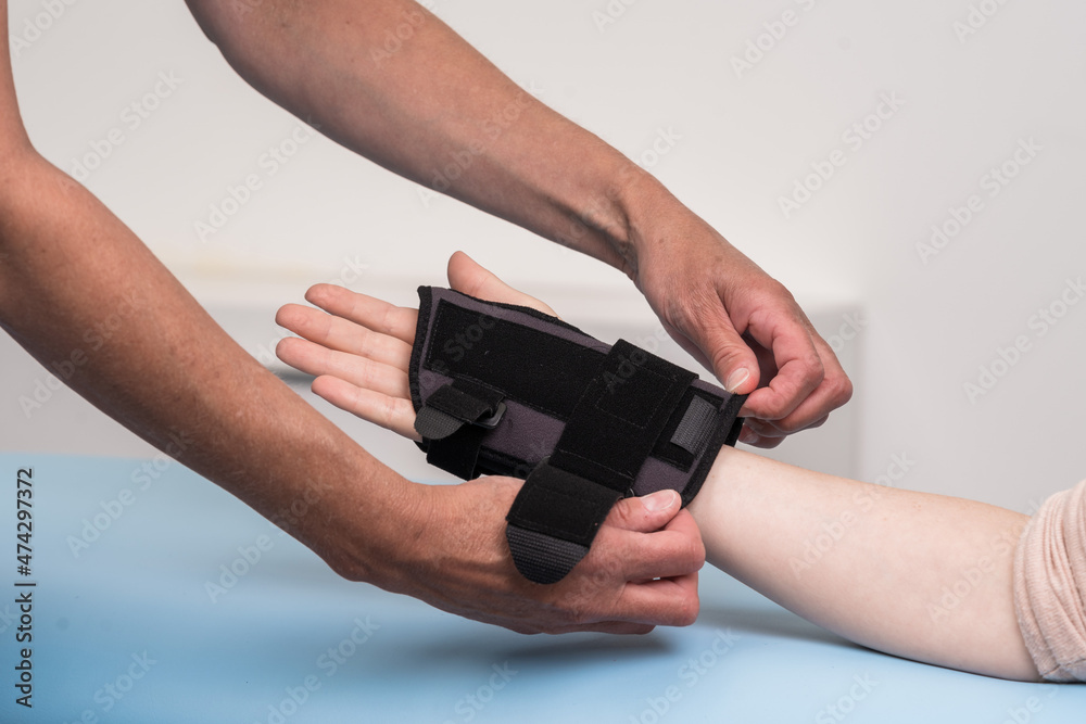surgery, elbow, medical, pharmaceutical, glove, fingers, wrist, radiocarpal  joint, impaired, band, injury, tubular, brace, orthosis, tendon, nerve,  carpal, compression, support, hurt, tunnel, wrap, tu Stock Photo