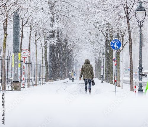 Photography silhouette of a person walking among heavy snowfall