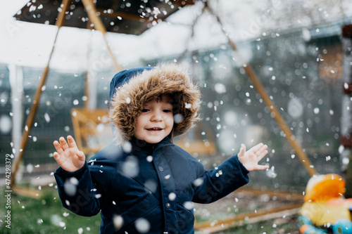 Happy child outside with winter jacket