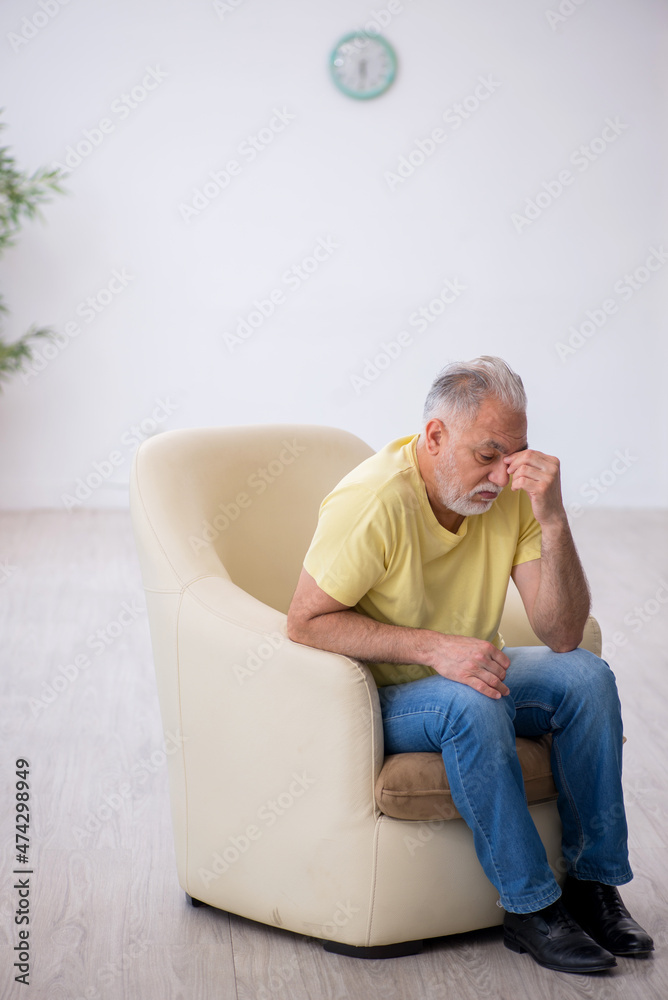 Old man waiting for the doctor psychotherapist Old man waiting for the doctor psychotherapist