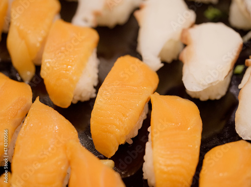 Shizuoka,Japan - December 10, 2021: Closeup of salmon and octopus nigiri sushi 
