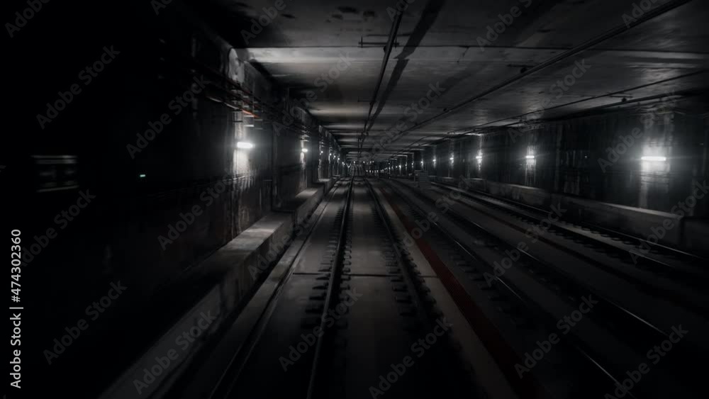 Back cabin view of driverless metro train moving through underground tunnel. Automated advanced transportation system, subway in Delhi, India Back cabin view of driverless metro train moving through underground tunnel. Automated advanced transportation system, subway in Delhi, India