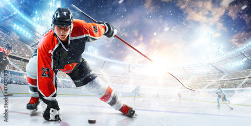 Sport. High concentration. Professional hockey player ready to attack in ice. Sports emotions. Concept of action  team sport game