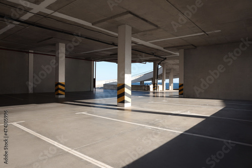 Empty open car parking near sea on sunny day