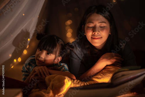 young Asian mother with lit...