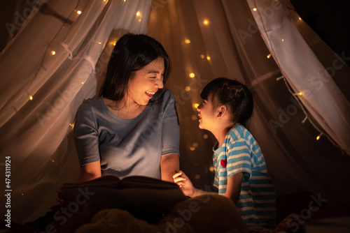 young Asian mother with lit...
