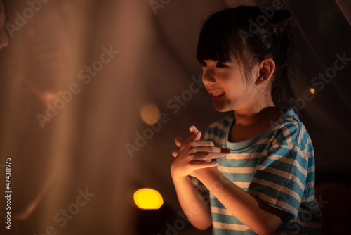 young Asian mother with lit...