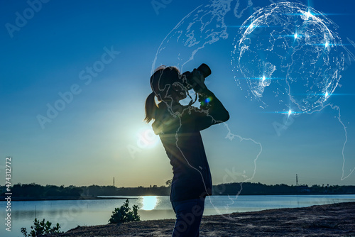 Asian women Hand Holding Binoculars / looking / watching using Binoculars with copy space,Concept of The pursuit of profitable business in the future.