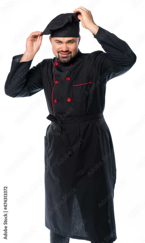 portrait of a male chef in a black suit, uniform with canned food, plate, basket, saucepan, frying pan or knives. isolated white background portrait of a male chef in a black suit, uniform with canned food, plate, basket, saucepan, frying pan or knives. isolated white background
