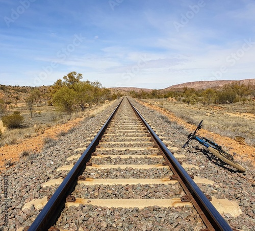 mountain bike near railroad tracks in the desert