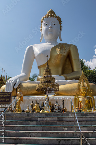 Within Wat Phra That Doi Kham is a Buddhist temple in Chiang Mai province northern of Thailand. © Thanaphon