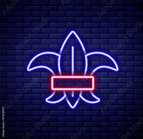 Glowing neon line Fleur de lys or lily flower icon isolated on brick wall background. Colorful outline concept. Vector