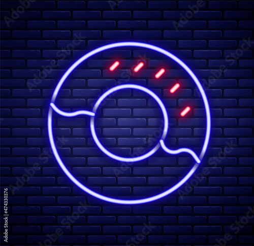 Glowing neon line Donut with sweet glaze icon isolated on brick wall background. Colorful outline concept. Vector