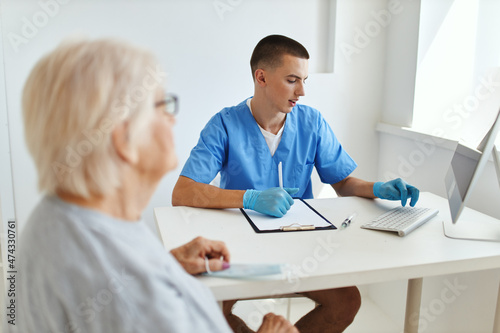 elderly woman talking to doctor health care