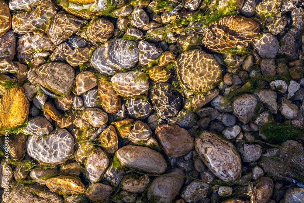 multi colorful stones under the clean water. multi colorful stones under the clean water.