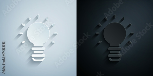 Paper cut Creative lamp light idea icon isolated on grey and black background. Concept ideas inspiration, invention, effective thinking, knowledge and education. Paper art style. Vector