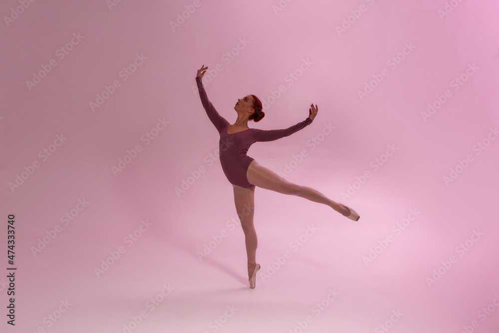 Elegant fit girl dancing ballet dance in studio