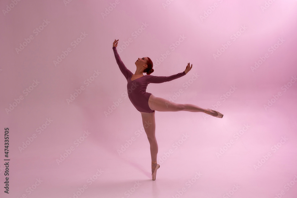 Beautiful girl dancing ballet dance in studio