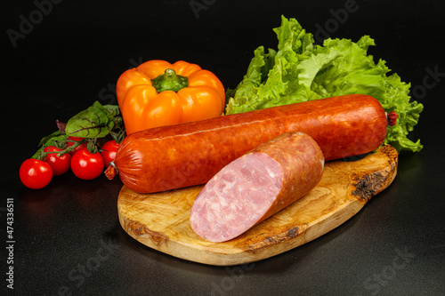 Pork ham sausage cut isolated