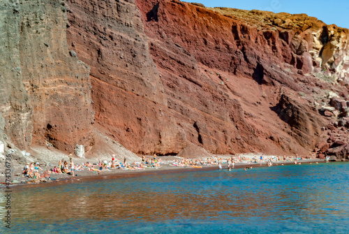 Tourists on the shores of the Red Beach in Santorini