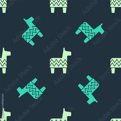 Green and beige Pinata icon isolated seamless pattern on blue background. Mexican traditional birthday toy. Vector