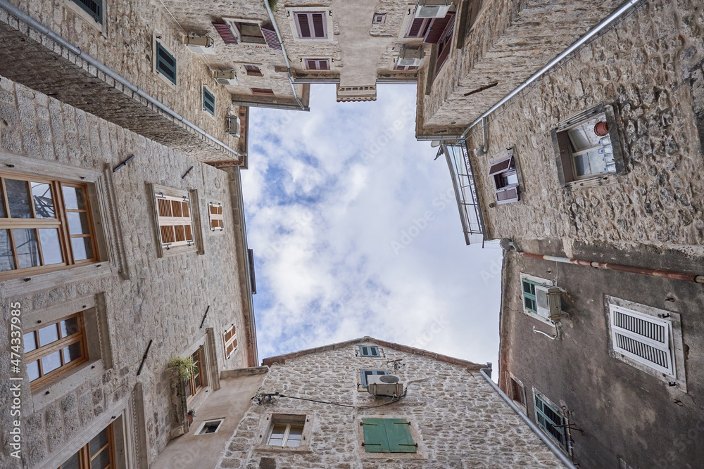 Low angles shot of old stone buildings in the old town of Kotor, Montenegro